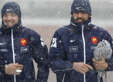 Vincent Clerc, left, and former French team-mate Clement Poitrenaud arrive for training in the snow.