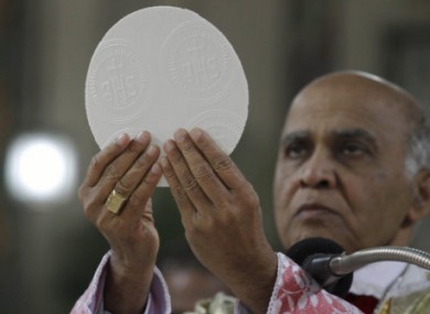 A priest in India celebrating Christmas mass in December 2010.