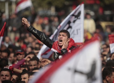 An Egyptian soccer fan shouts anti-ruling military council slogans during a protest at Sphinx square in Cairo today.