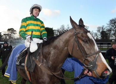 Tony McCoy with Synchronised in the parade ring after winning The Lexus Steeplechase.