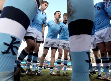 St Michael’s Oisin O'Meara talks to his team-mates.