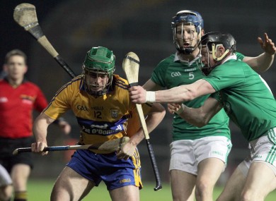 Clare's Sean Collins with Wayne McNamara and Connor Allis of Limerick
