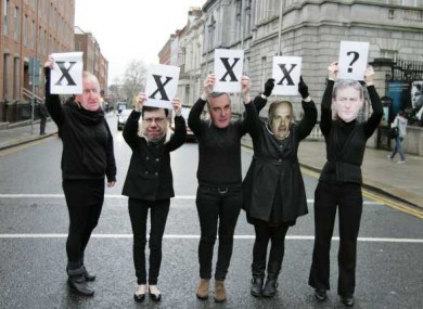 Members of Action on X - wearing masks of former Taoisigh who failed to legislate for the X case ruling - protest at the Dáil yesterday.