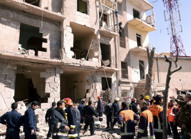 s Syrian rescue teams investigating the scene after an explosion in a residential neighborhood in Aleppo, Syria, on Sunday