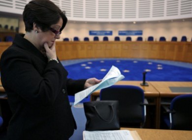 Carmel Stewart, a lawyer for A B and C, reads the ECHR's ruling at its courtroom in Strasbourg.