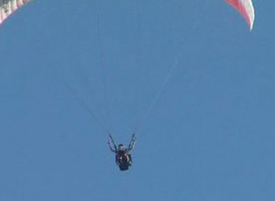 Mary Hardison glides to a gentle landing after flying hundreds of feet in the air with an instructor in this undated photo.