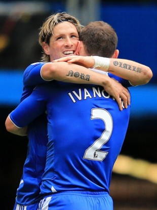 The striker hugs team-mate Branislav Ivanovic.