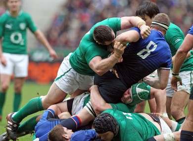 Cian Healy clears Imanol Harinordoquy.