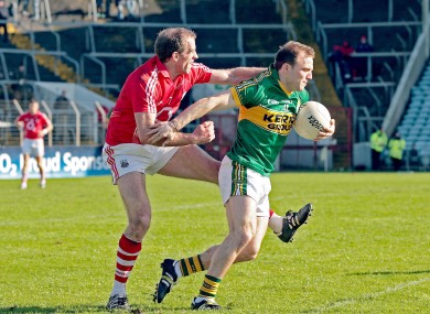 Cork's Paudie Kissane challenges Darran O'Sullivan of Kerry.