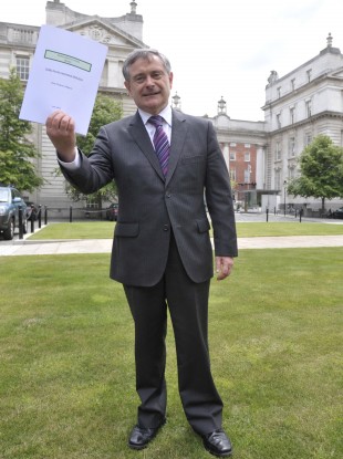 Labour Party Minister Brendan Howlin with the First Progress Report of the Implementation Body on the Croke Park Agreement.