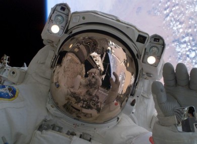 Discovery astronauts carry out a spacewalk in 2005.