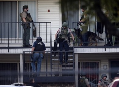 Police at an apartment near the scene of the kidnapping.