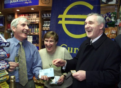 Then Taoiseach Bertie Ahern having a laugh with Jim and Marian O'Neill at their newsagents shop where he spent his first euro on 1 January 2002 after the changeover from punts.