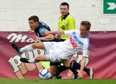 St. Pat's Darren Meenan and Barry McCabe of UCD tussle for possession