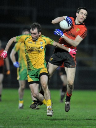Gordon, right, in action against Donegal's Karl Lacey.