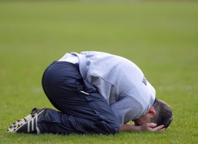 Clare manager Davy Fitzgerald sinks to his knees to celebrate yesterday's win in the Division 1B final.