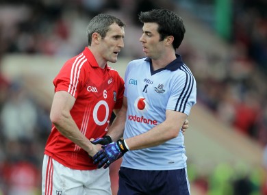 Cork's Graham Canty with Michael Darragh MacAuley of Dublin at the end of the game.