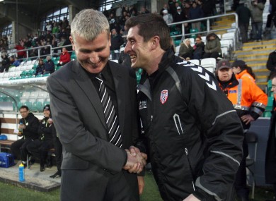 Shamrock Rovers manager Stephen Kenny and Derry City manager Declan Devine share a word before this evening's game in Tallaght.