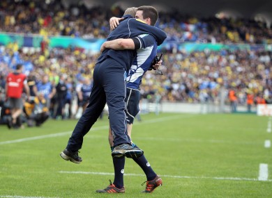 what it feels like to win in France. Joe Schmidt embraces Jonathan Sexton.