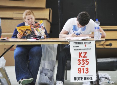Presiding Officer Sinead Magee and Conor O'Higgins wait for voters at Shankill.