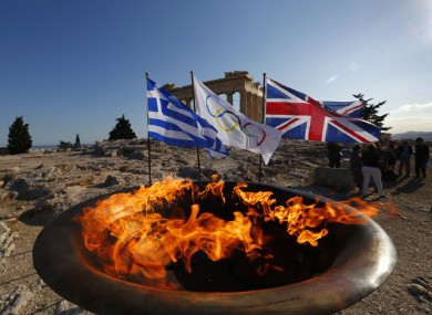 The cauldron with the Olympic Flame is seen atop the Athens Acropolis yesterday.