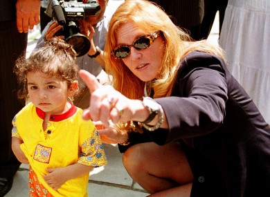 Sarah Ferguson beside a Turkish child during her visit to Turkey in 1998
