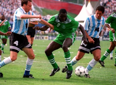 Rashidi Yekini of Nigeria battles with Roberto Sensini and Diego Simeone of Argentina.
