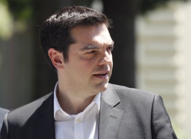Greek leftist leader Alexis Tsipras leaves the Presidential Palace yesterday.