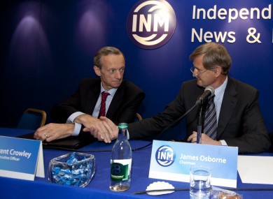 Outgoing Chairman James Osborne (R) shakes hands with CEO Vincent Crowley at the Independent News & Media AGM in Citywest, Dublin today