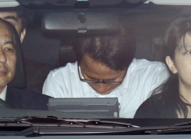 Katsuya Takahashi is driven to Tokyo Metropolitan Police Department after being arrested