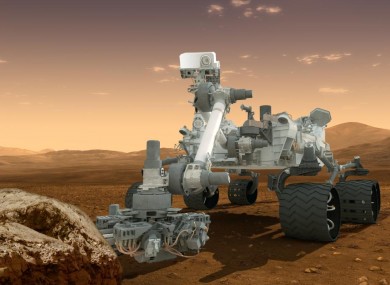 Artist's depiction of the Curiosity rover at work on Mars.