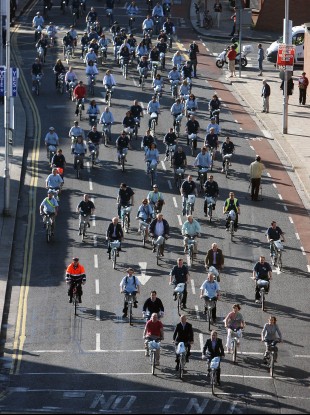 Cyclists on Dublin bikes crossing the river Liffey
