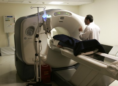 File photo of nuclear medicine technologist Michael Gomex speaking to a patient