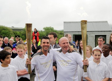 Wayne McCullough and Michael Carruth pictured at the border crossing where the handover of the Olympic torch took place.