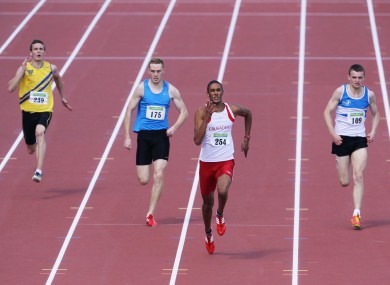 Stephen Colvert, second from right, powers clear to win the men's 200m title.