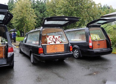 The three hearses carrying the coffins of the Doyle brothers.