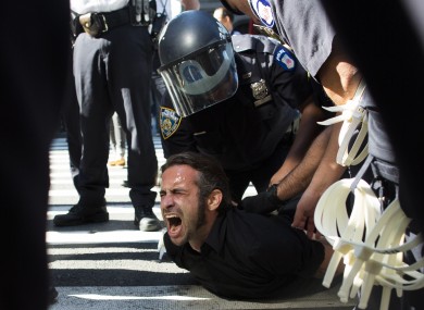 Occupy Wall Street protestor Chris Philips screams as he is arrested near Zuccotti Park today.