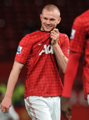 Ryan Tunnicliffe smiles as he leaves the Old Trafford pitch.