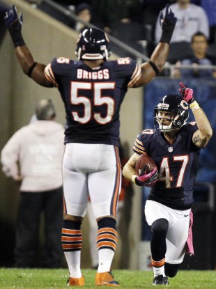 Bears safety Chris Conte (47) celebrates with linebacker Lance Briggs (55) after intercepting a pass in the second half.