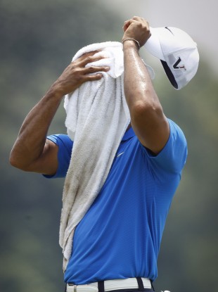 Tiger Woods takes time out in Malaysia.