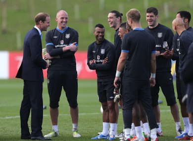 Britain's Duke of Cambridge meets England players after training.
