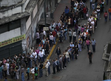 People line up to vote in Caracas in Venezuela today