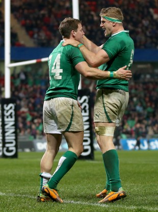 Craig Gilroy celebrates his second try with Jamie Heaslip.