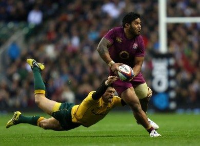 Manu Tuilagi tackled by Adam Ashley-Cooper.