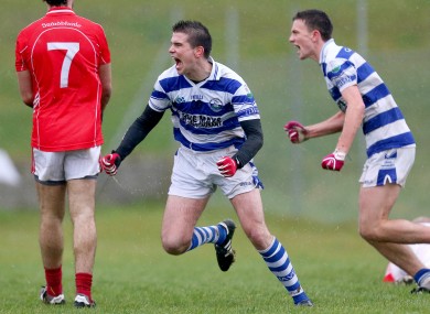 Castlehaven's Seanie Cahalane celebrates scoring his side's goal along with teammate Mark Collins.