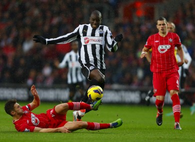 Newcastle's Demba Ba (centre) in action against Southampton's Adam Lallana during the Barclays Premier League match at St Mary's.