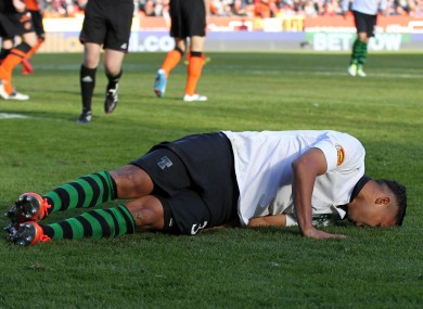 Celtic's Emillio Izaguirre in pain against Dundee United.
