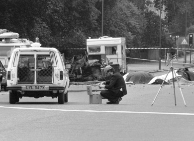 A police photographer at the scene, following the IRA's bombing of Hyde Park, London.