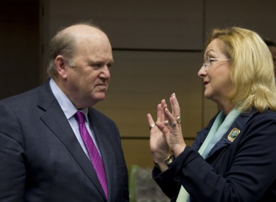 Finance Minister Michael Noonan, left, speaks with Austria's Finance Minister Maria Fekter during a meeting of EU finance ministers in Brussels on Wednesday.