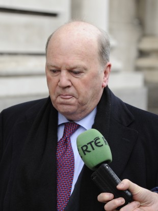 Man on a mission: Michael Noonan was tight-lipped as he walked to government buildings this morning.